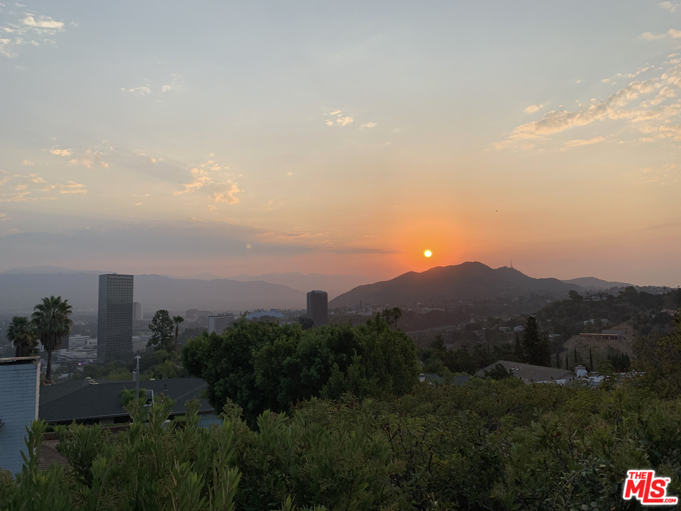 10935 Alta View Drive Studio City, CA 91604 - Photo 42 of 45 a view of a city and mountains in a room
