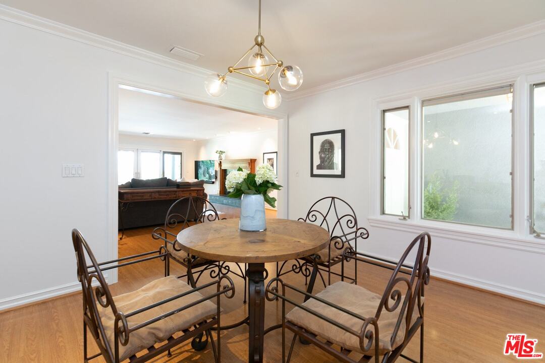 10935 Alta View Drive Studio City, CA 91604 - Photo 8 of 45 a view of a dining room with furniture and a chandelier