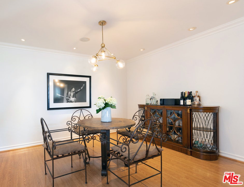 10935 Alta View Drive Studio City, CA 91604 - Photo 9 of 45 a view of a dining room with furniture and wooden floor