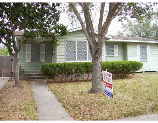 4118 Lowman Street Corpus Christi, TX 78411 - Photo 1 of 1 a sign board with a tree in front of it