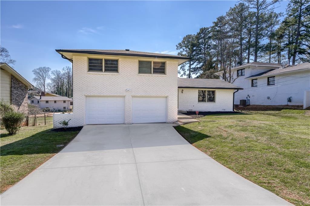 1888 Twin Falls Road Decatur, GA 30032 - Photo 1 of 1 a view of a house with backyard and trees