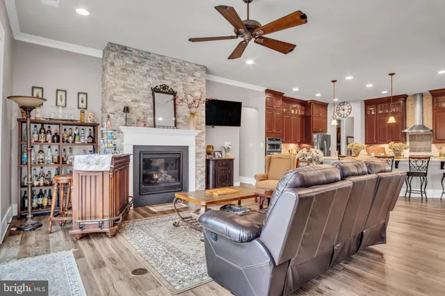 a bedroom with a bed and a flat tv screen on dresser