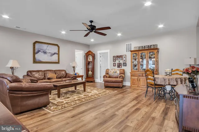 a backyard of a house with barbeque oven table and chairs