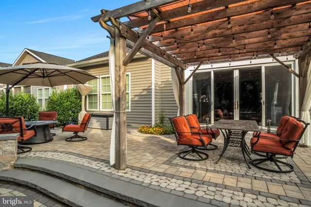 an aerial view of a house with a garden and lake view