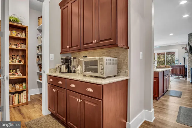 a kitchen with a cabinets and appliances