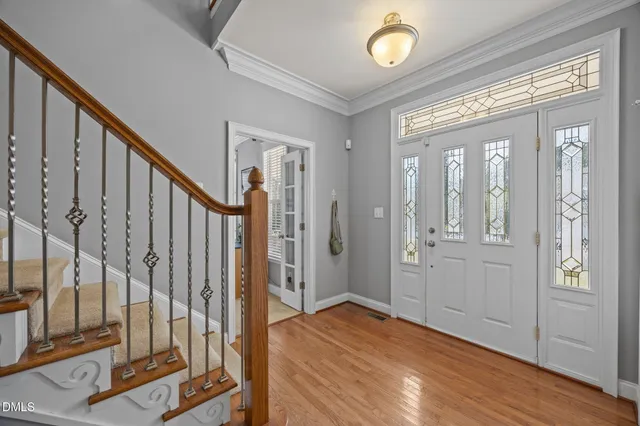 a view of a livingroom with furniture and a potted plant