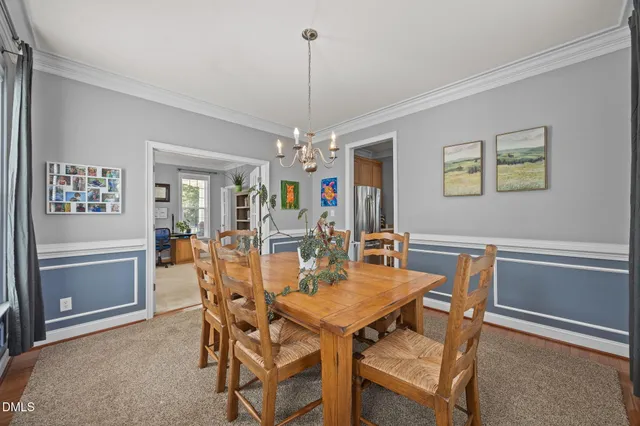 a large kitchen with stainless steel appliances granite countertop a lot of counter space and wooden floors