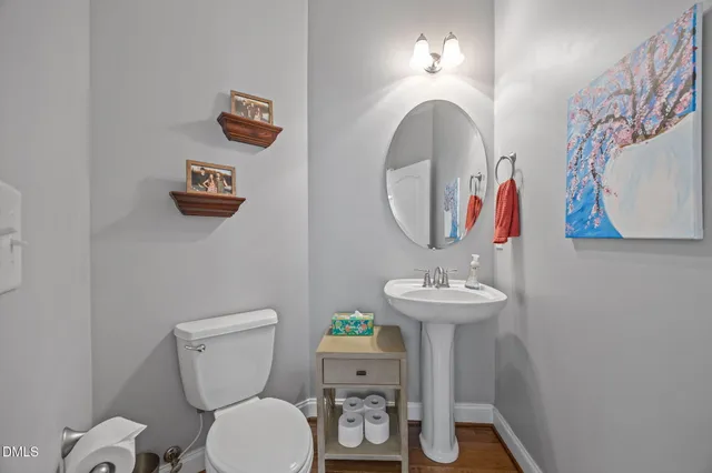 a view of a hallway with bedroom and wooden floor