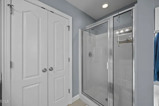 a bathroom with a sink vanity and a mirror
