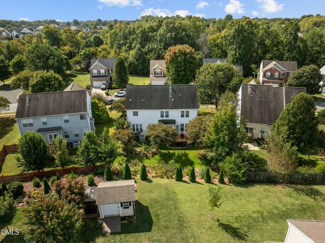 an aerial view of a house with a garden