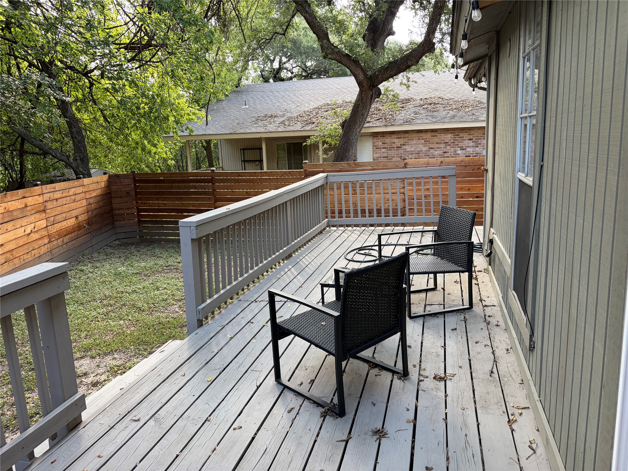 1400 Vista Ridge Cove, Unit B Austin, TX 78754 - Photo 22 of 25 An inviting deck offers a prime outdoor living space, perfect for tranquil mornings or relaxed evenings.