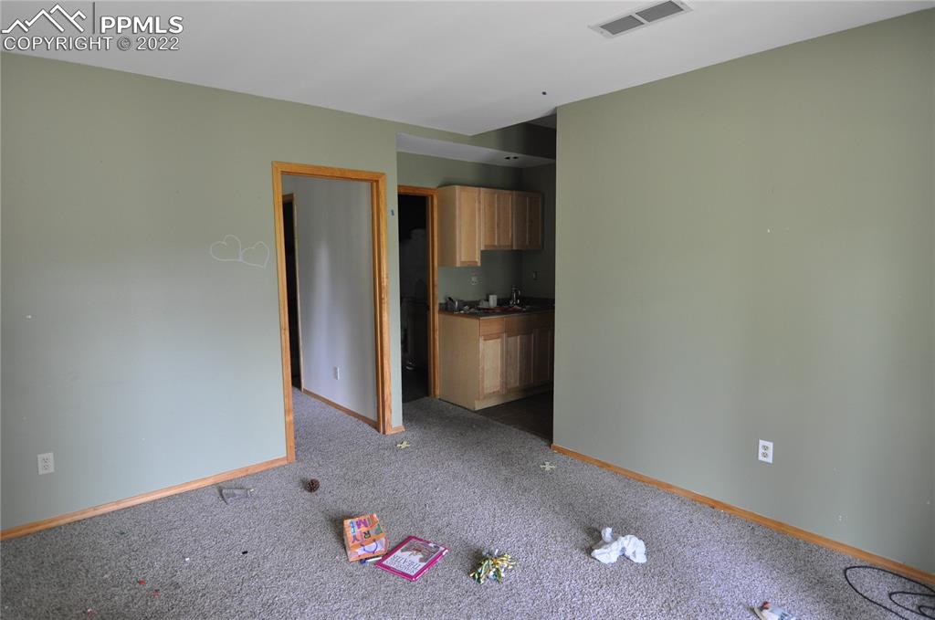421 Maroon Lake Circle Divide, CO 80814 - Photo 7 of 19 an empty room with a kitchen