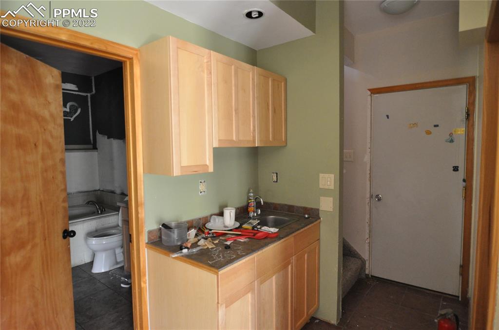 421 Maroon Lake Circle Divide, CO 80814 - Photo 9 of 19 a kitchen that has a sink and a stove in it