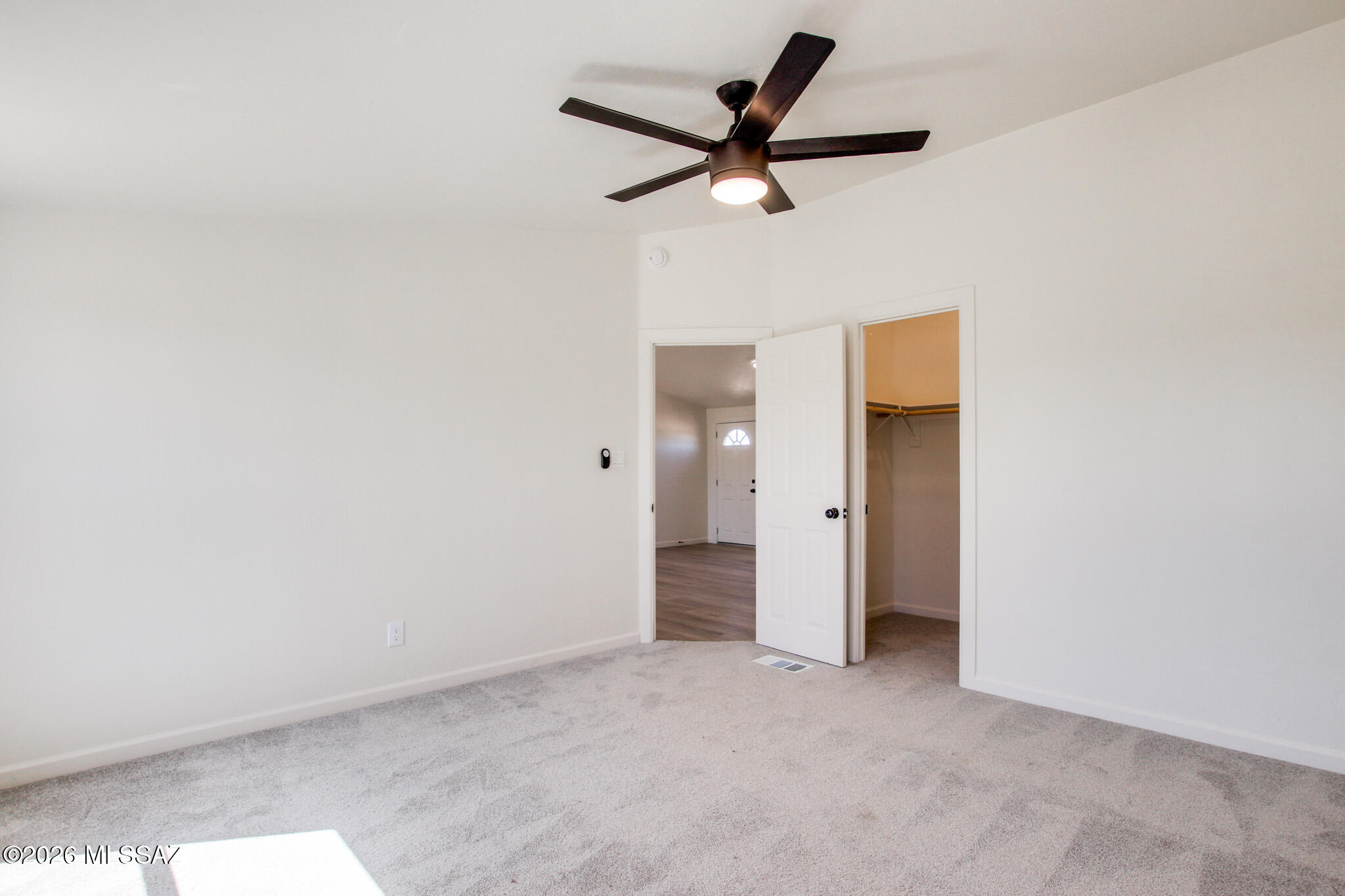 14303 West Rolina Lane Tucson, AZ 85736 - Photo 23 of 38 a view of a livingroom with a ceiling fan and wooden floor
