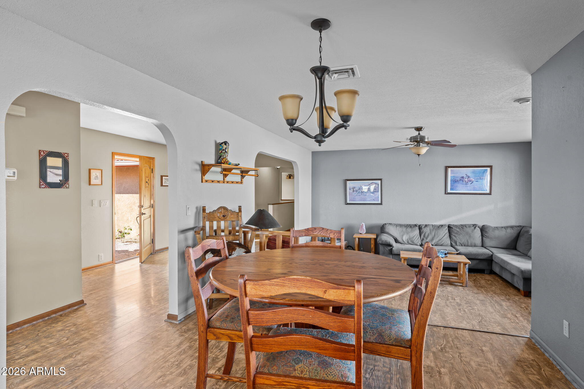 35085 South Turtle Creek Road Wickenburg, AZ 85390 - Photo 21 of 55 a view of a dining room with furniture and wooden floor