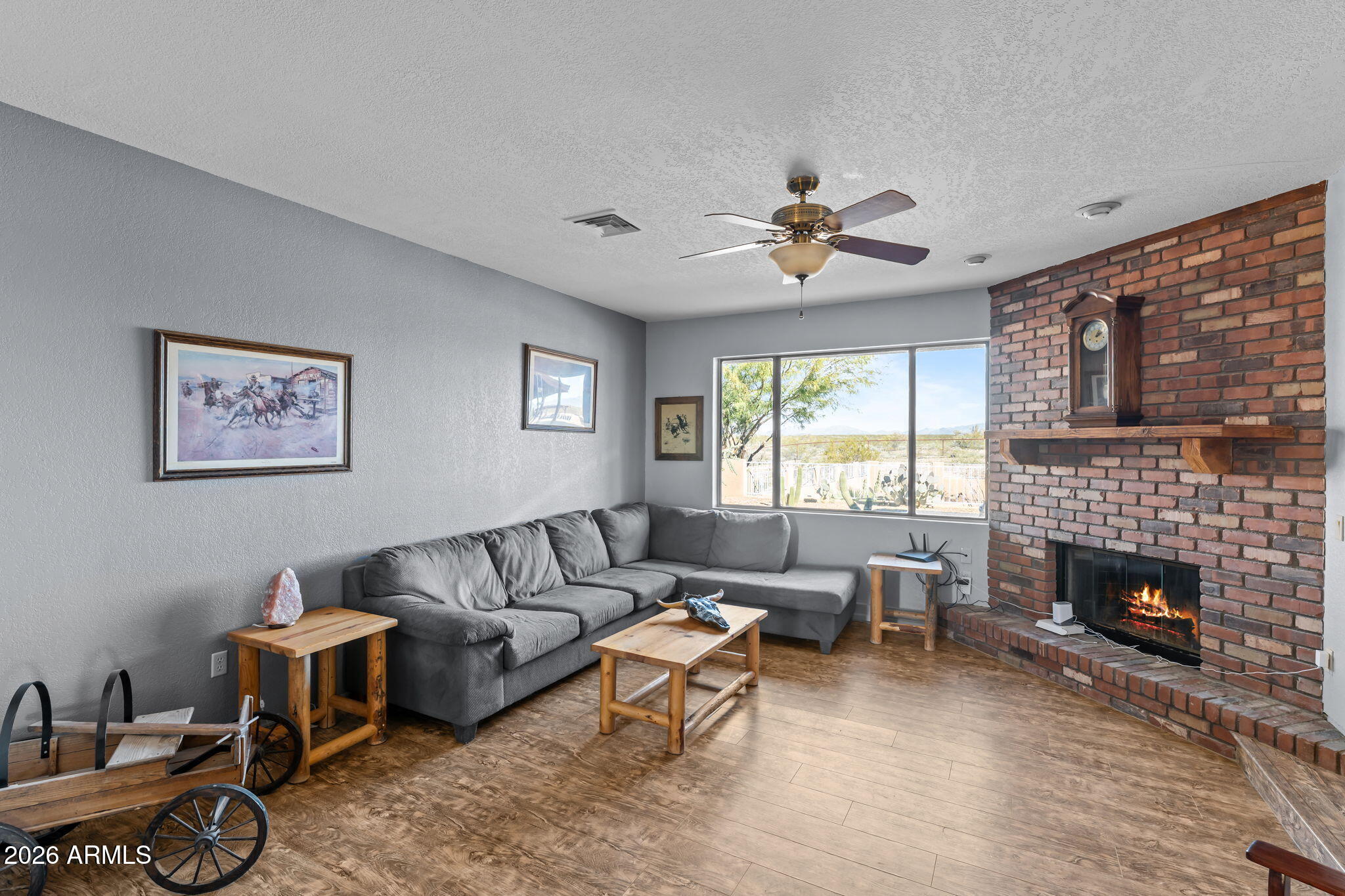 35085 South Turtle Creek Road Wickenburg, AZ 85390 - Photo 22 of 55 a living room with furniture fireplace and window