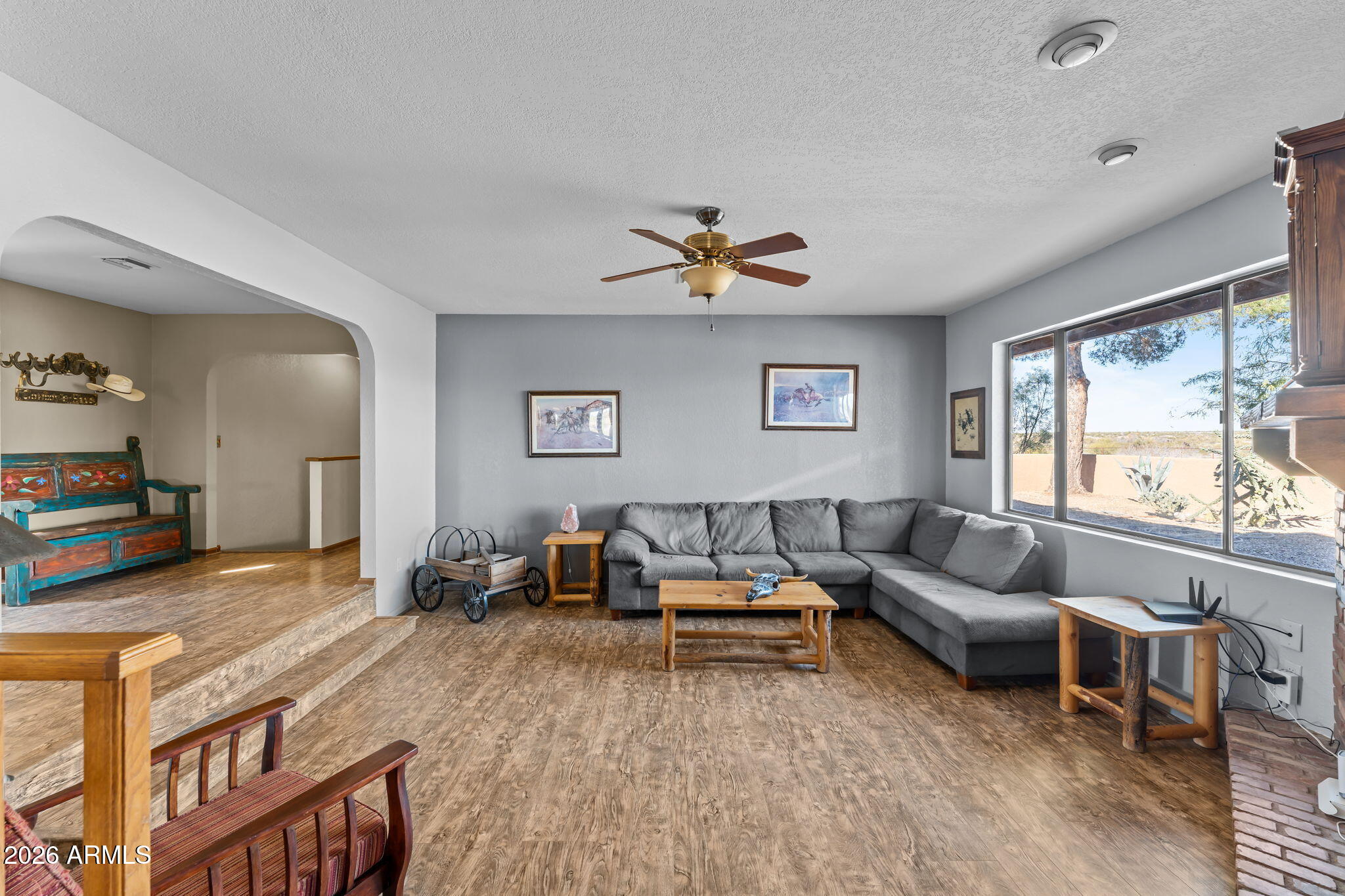 35085 South Turtle Creek Road Wickenburg, AZ 85390 - Photo 23 of 55 a living room with furniture and a large window