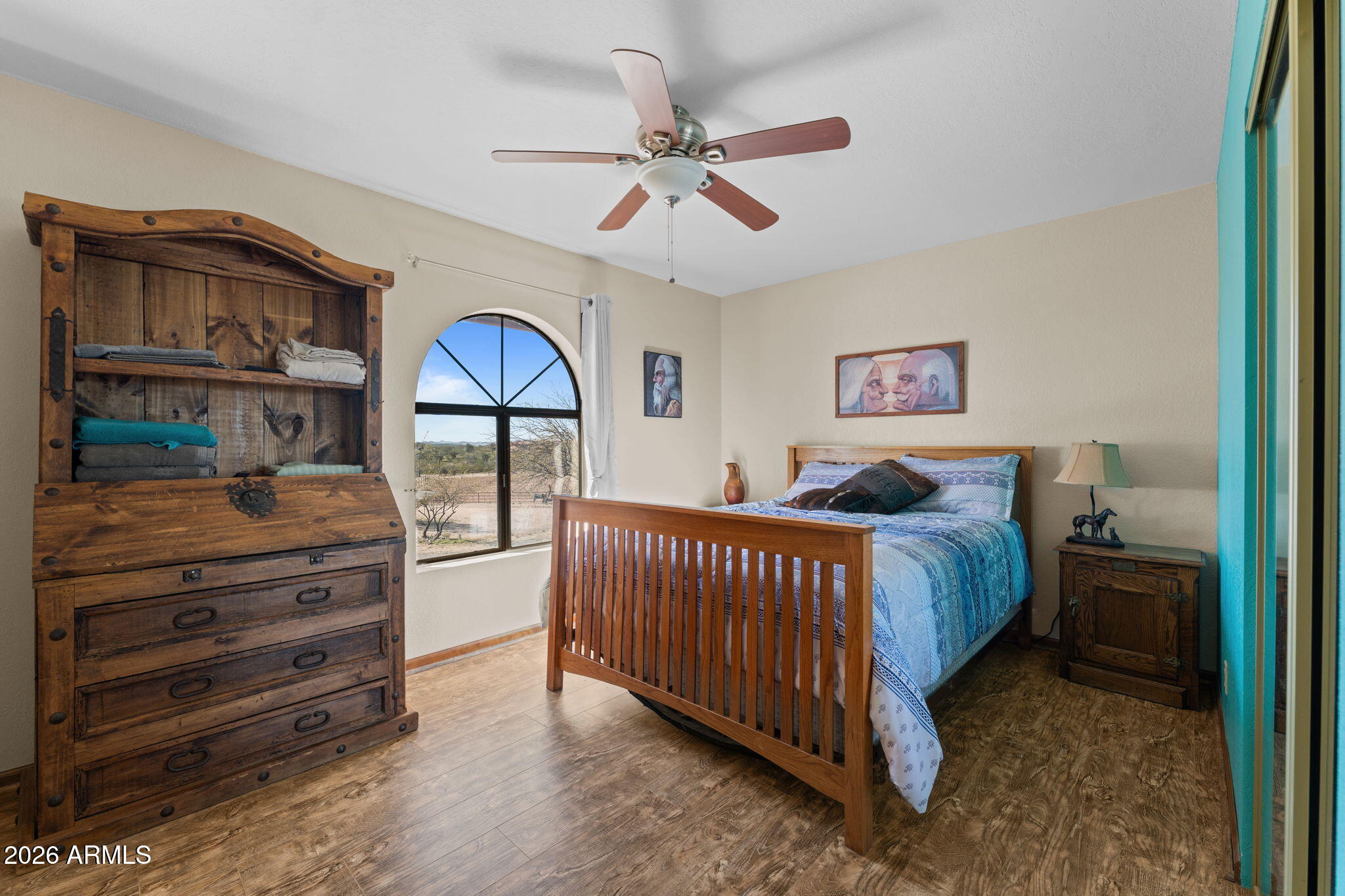 35085 South Turtle Creek Road Wickenburg, AZ 85390 - Photo 25 of 55 a spacious bedroom with a bed and a dresser