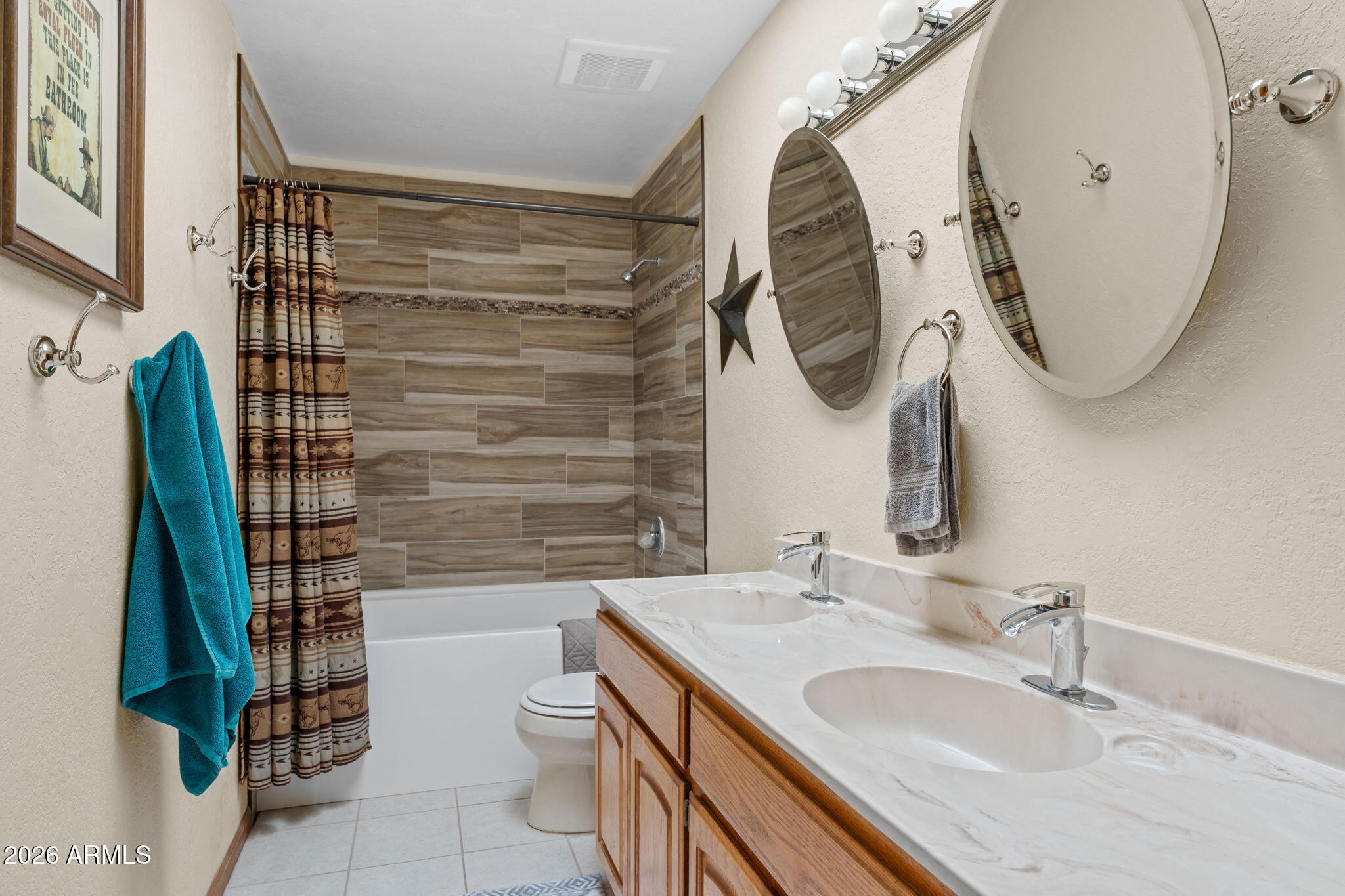 35085 South Turtle Creek Road Wickenburg, AZ 85390 - Photo 27 of 55 a bathroom with a sink and a mirror