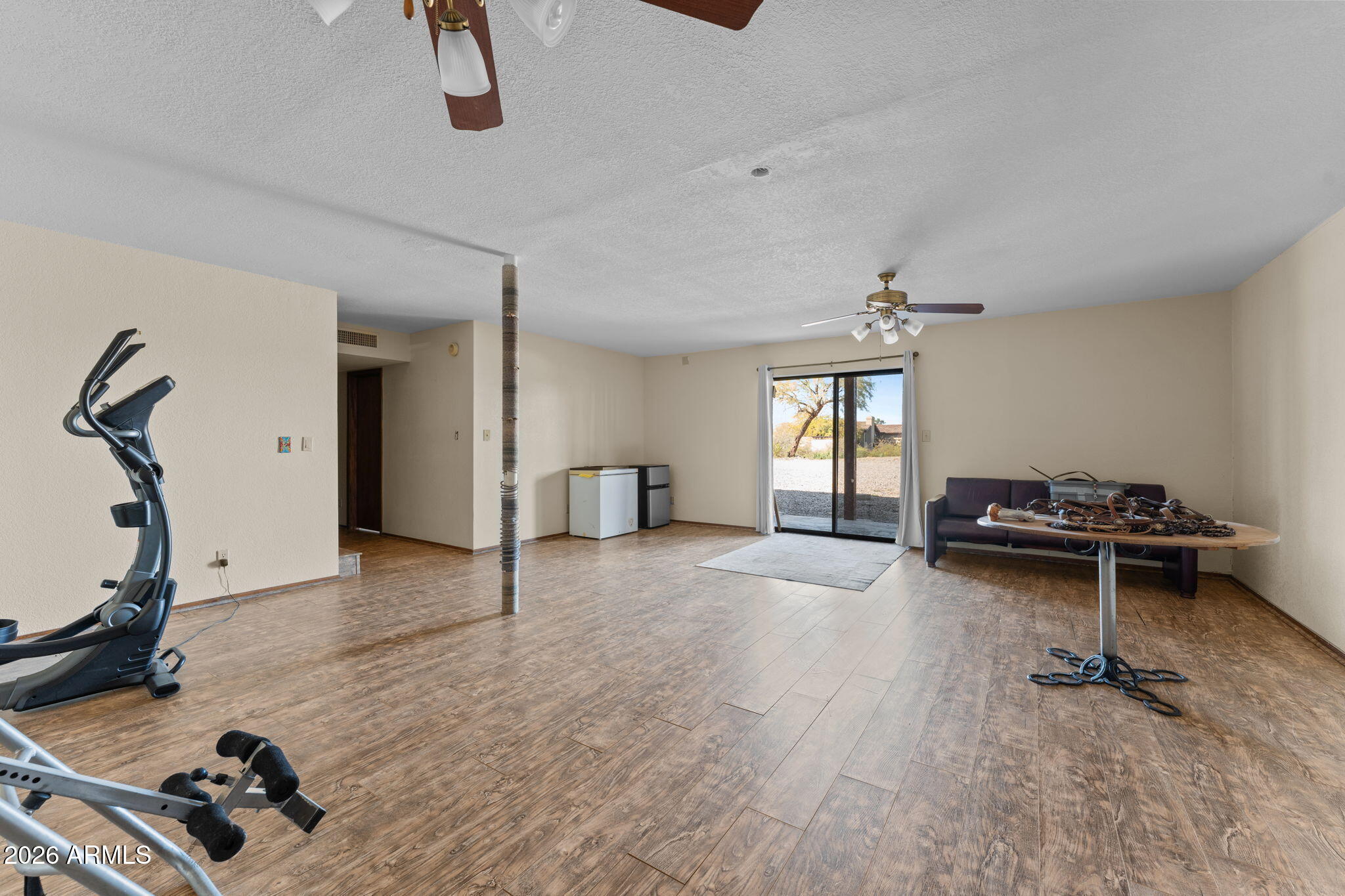 35085 South Turtle Creek Road Wickenburg, AZ 85390 - Photo 29 of 55 a view of a room with gym equipment and a window