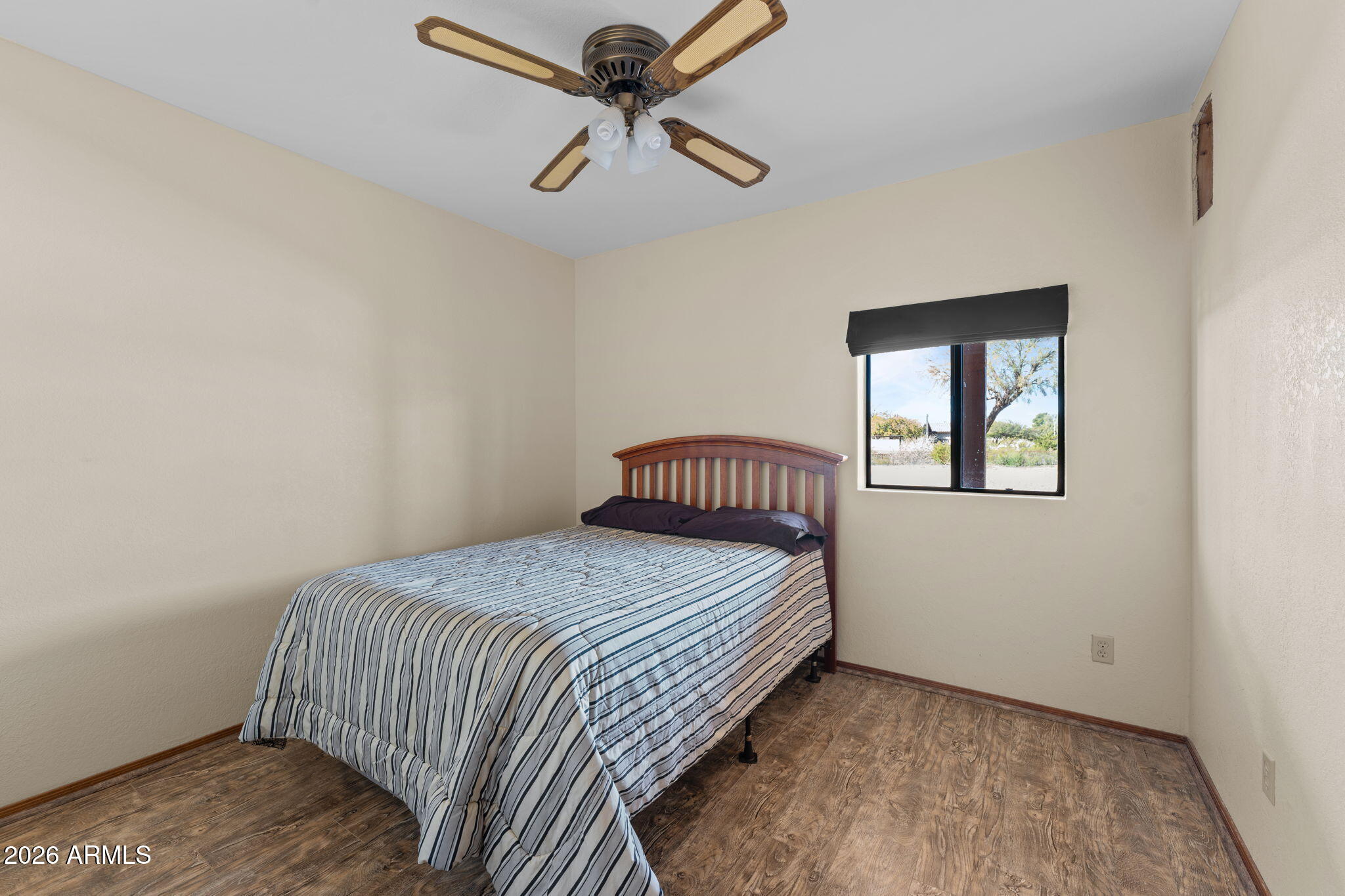 35085 South Turtle Creek Road Wickenburg, AZ 85390 - Photo 31 of 55 a bedroom with a bed and a window