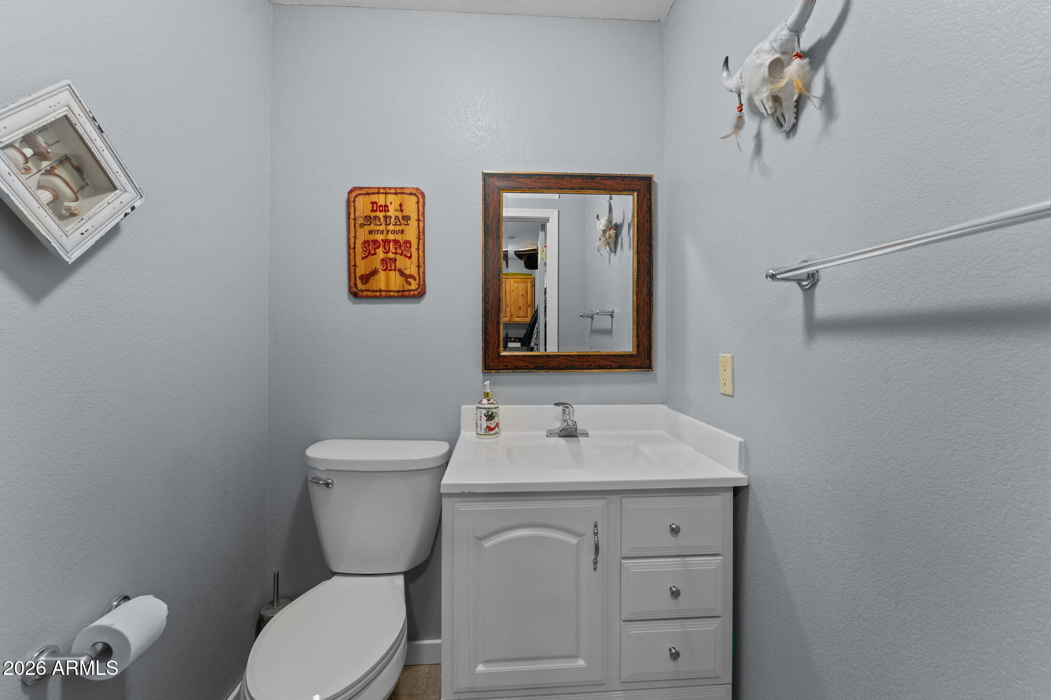 35085 South Turtle Creek Road Wickenburg, AZ 85390 - Photo 38 of 55 a bathroom with a toilet sink and mirror