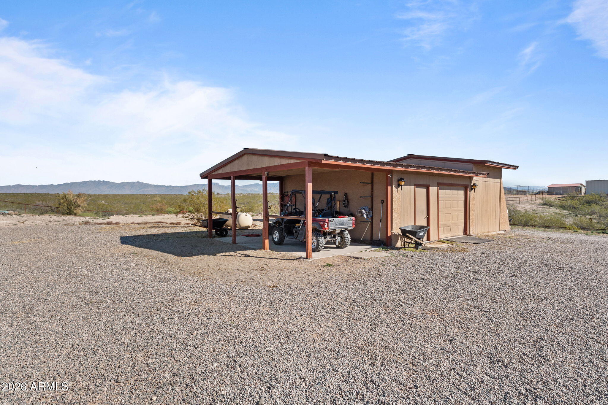 35085 South Turtle Creek Road Wickenburg, AZ 85390 - Photo 46 of 55 a view of a house with sitting area and garden