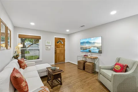 a bedroom with furniture and a window