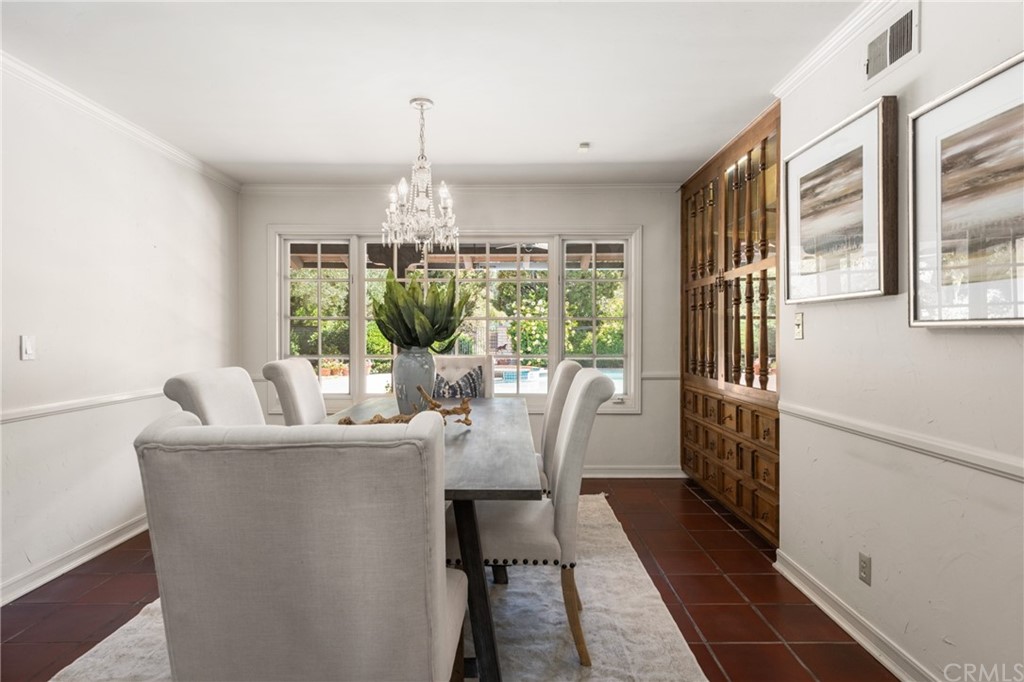 2012 Omega Drive North Tustin, CA 92705 - Photo 16 of 41 a dining room with furniture a chandelier and wooden floor