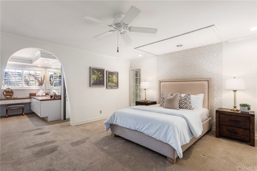 2012 Omega Drive North Tustin, CA 92705 - Photo 22 of 41 a bedroom with a large bed and a chandelier