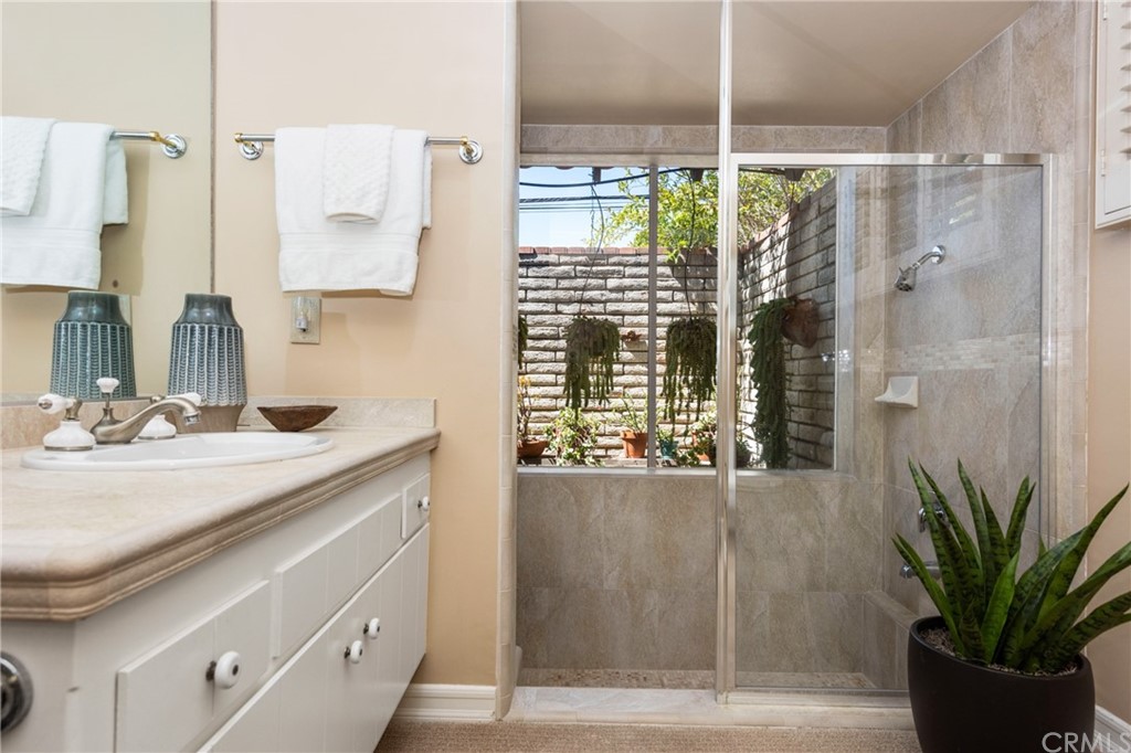 2012 Omega Drive North Tustin, CA 92705 - Photo 24 of 41 a bathroom with a shower curtain and a sink