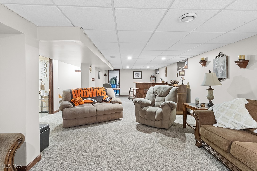 5225 Roseside Avenue Parma, OH 44134 - Photo 21 of 22 Carpeted living area with recessed lighting, baseboards, a drop ceiling, and indoor bar