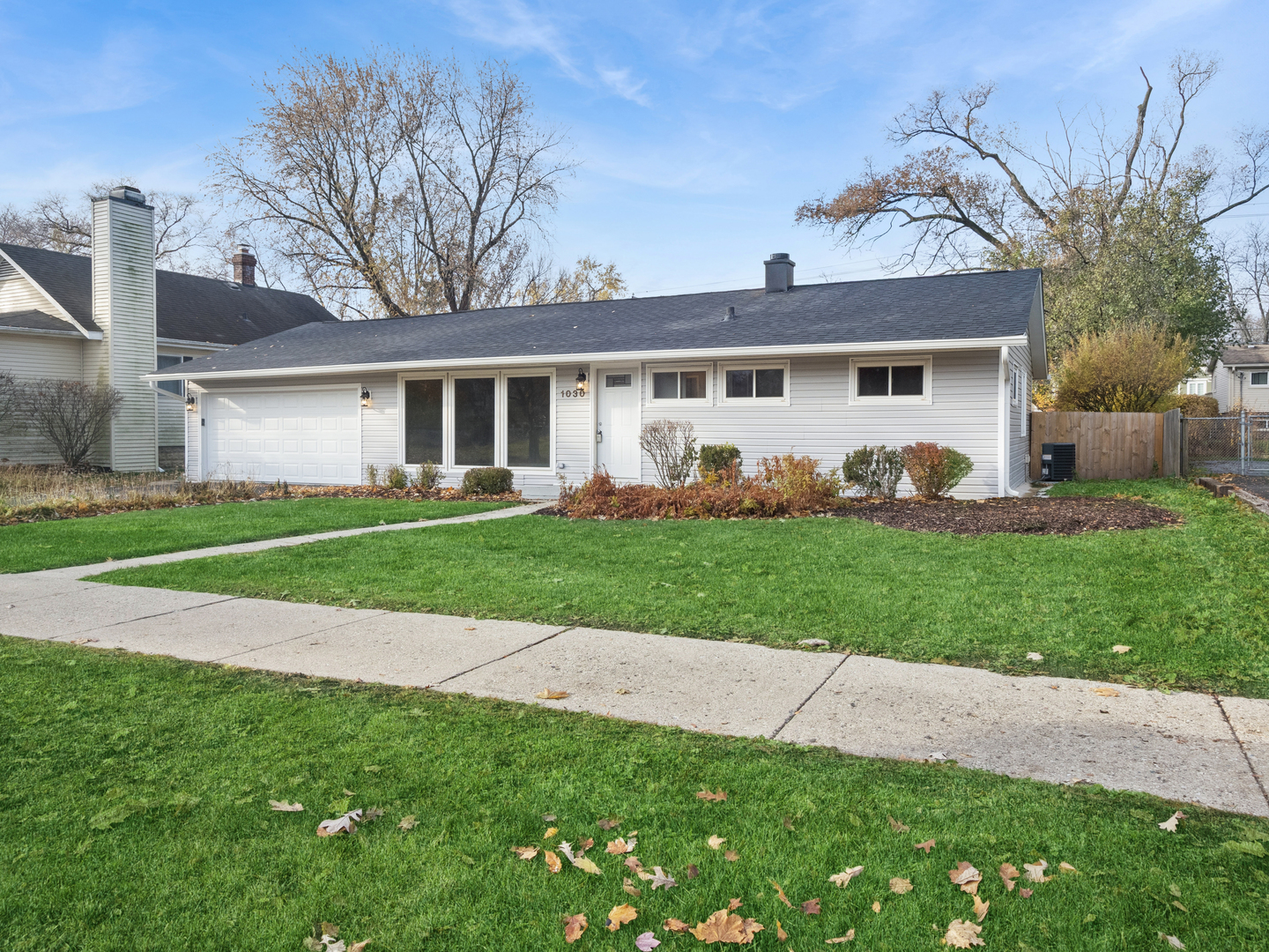 1030 Chestnut Street Deerfield, IL 60015 - Photo 8 of 11 a front view of a house with a yard and trees