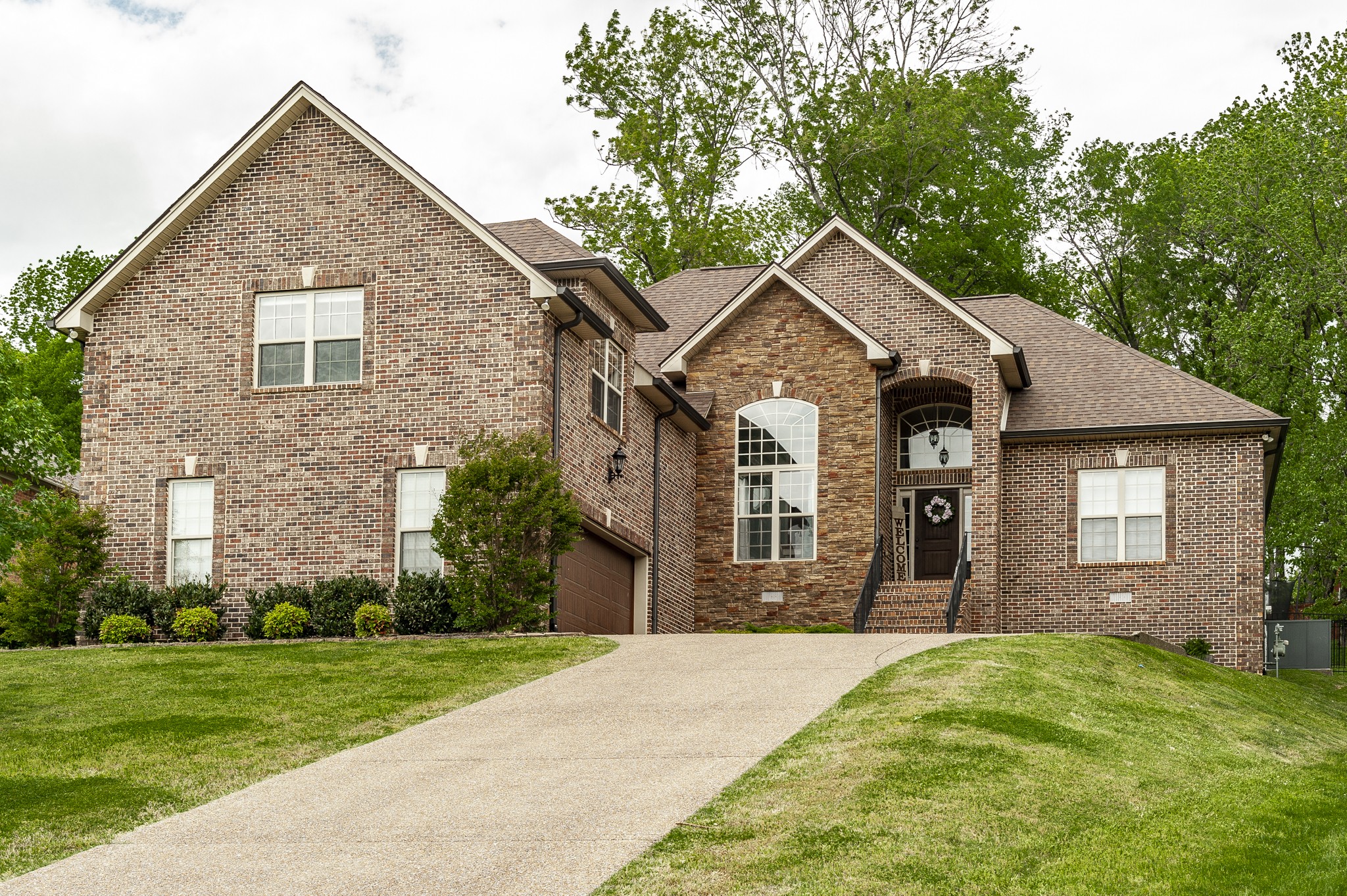 1145 Kimberly Drive Goodlettsville, TN 37072 - Photo 1 of 70 a front view of a house with a yard and garage