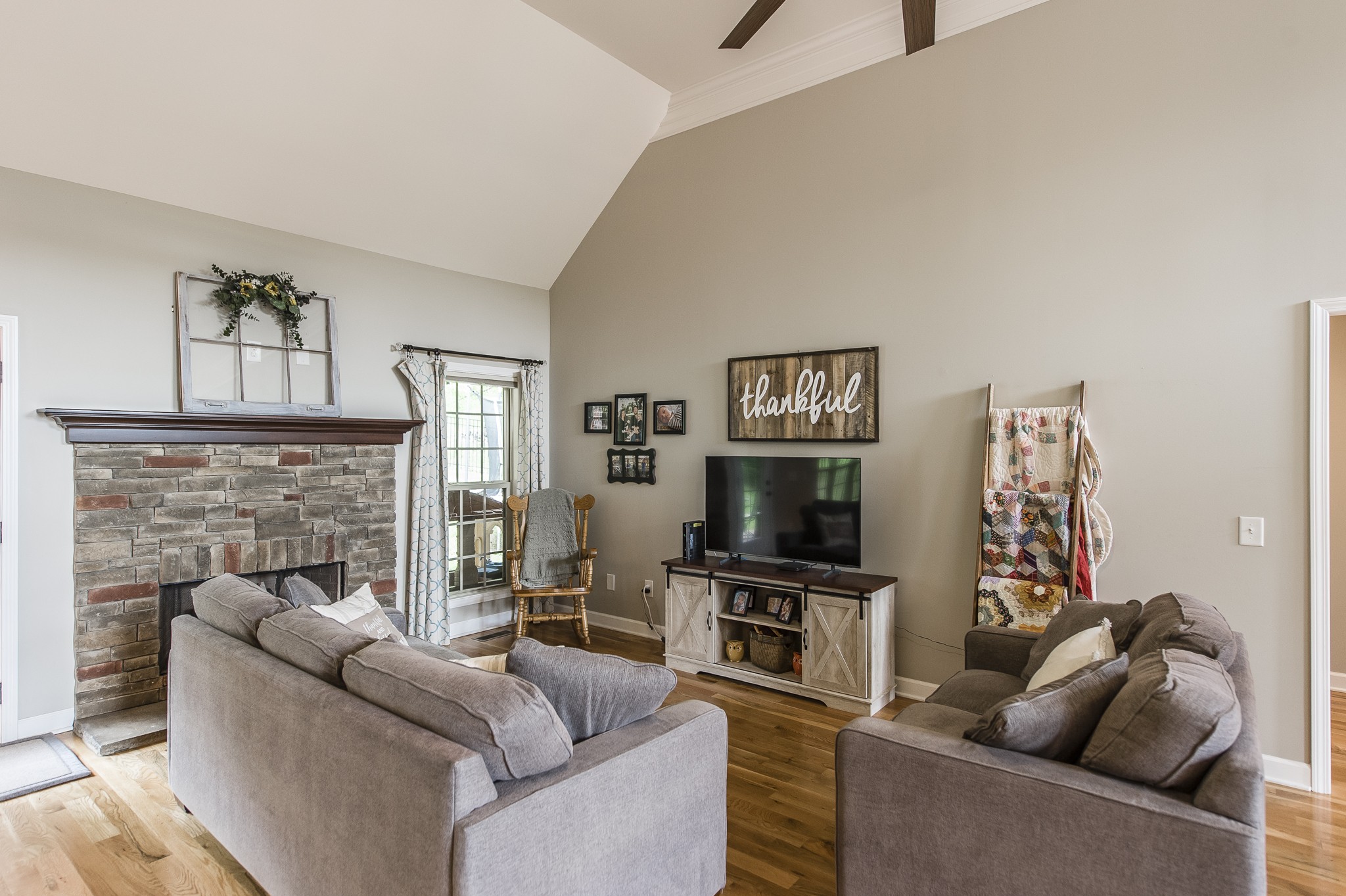 1145 Kimberly Drive Goodlettsville, TN 37072 - Photo 12 of 70 a living room with furniture a fireplace and a flat screen tv