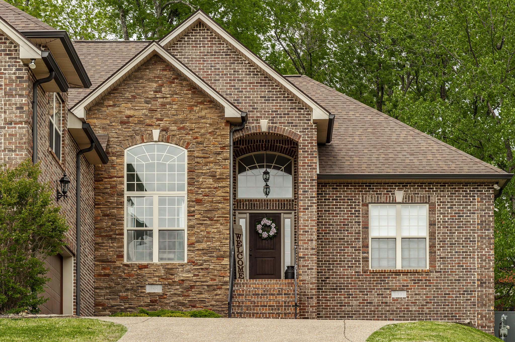 1145 Kimberly Drive Goodlettsville, TN 37072 - Photo 2 of 70 a front view of a house with garden