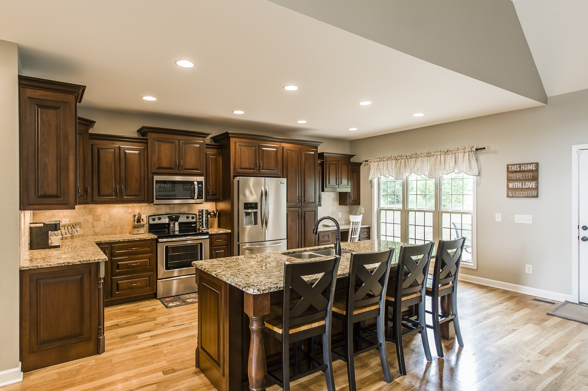 1145 Kimberly Drive Goodlettsville, TN 37072 - Photo 21 of 70 a kitchen with stainless steel appliances granite countertop a kitchen island hardwood floor a stove and a refrigerator