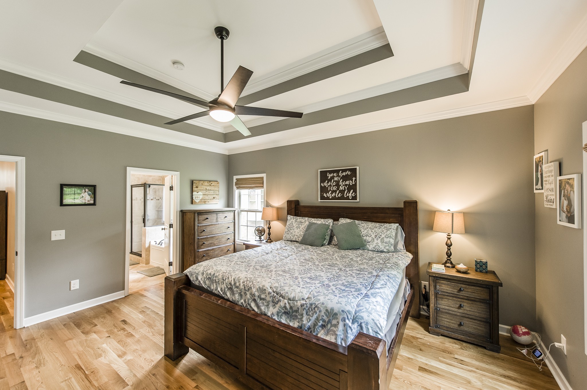 1145 Kimberly Drive Goodlettsville, TN 37072 - Photo 41 of 70 a bedroom with a bed and a chandelier