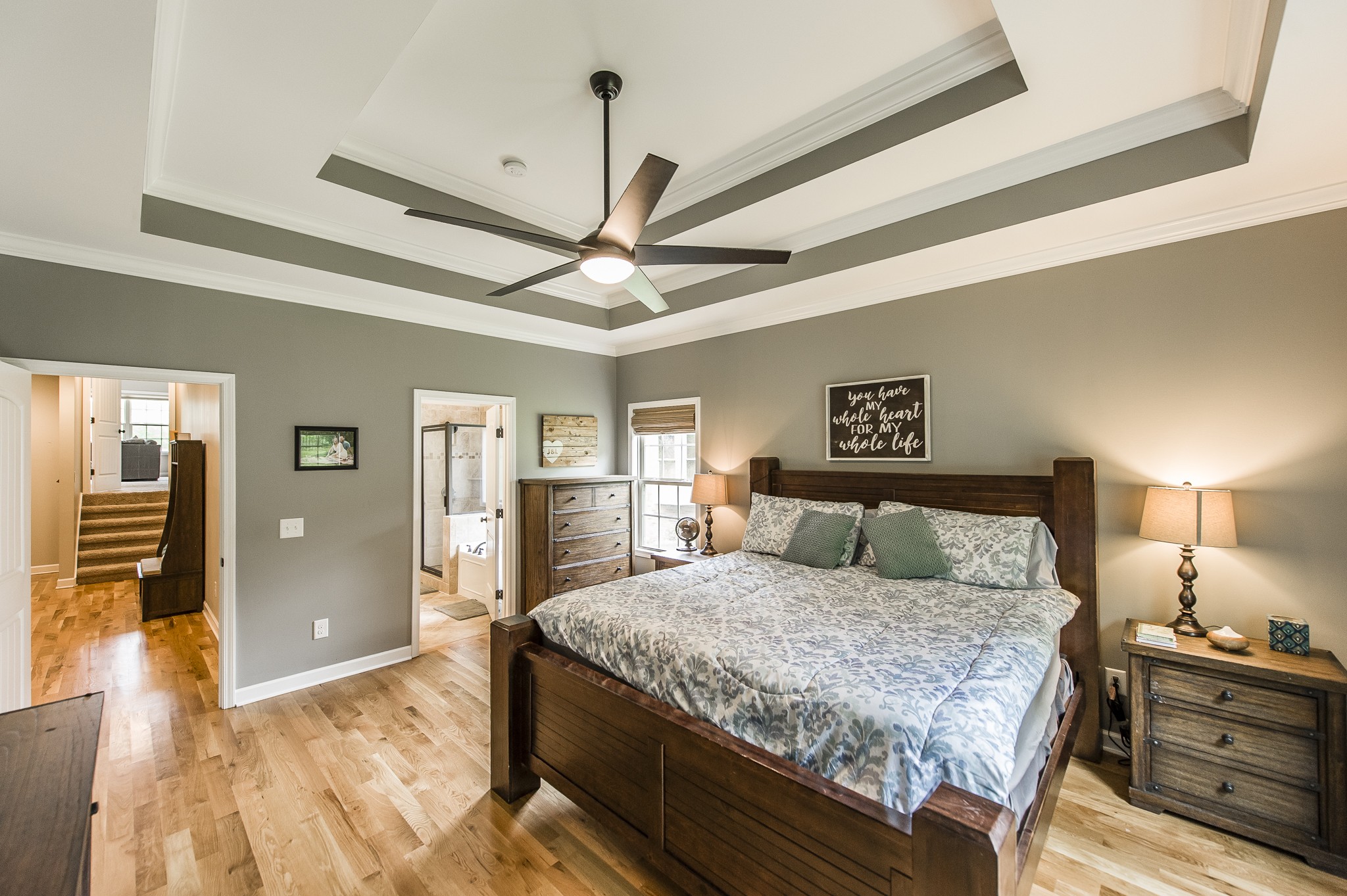 1145 Kimberly Drive Goodlettsville, TN 37072 - Photo 42 of 70 a bedroom with a large bed and a chandelier