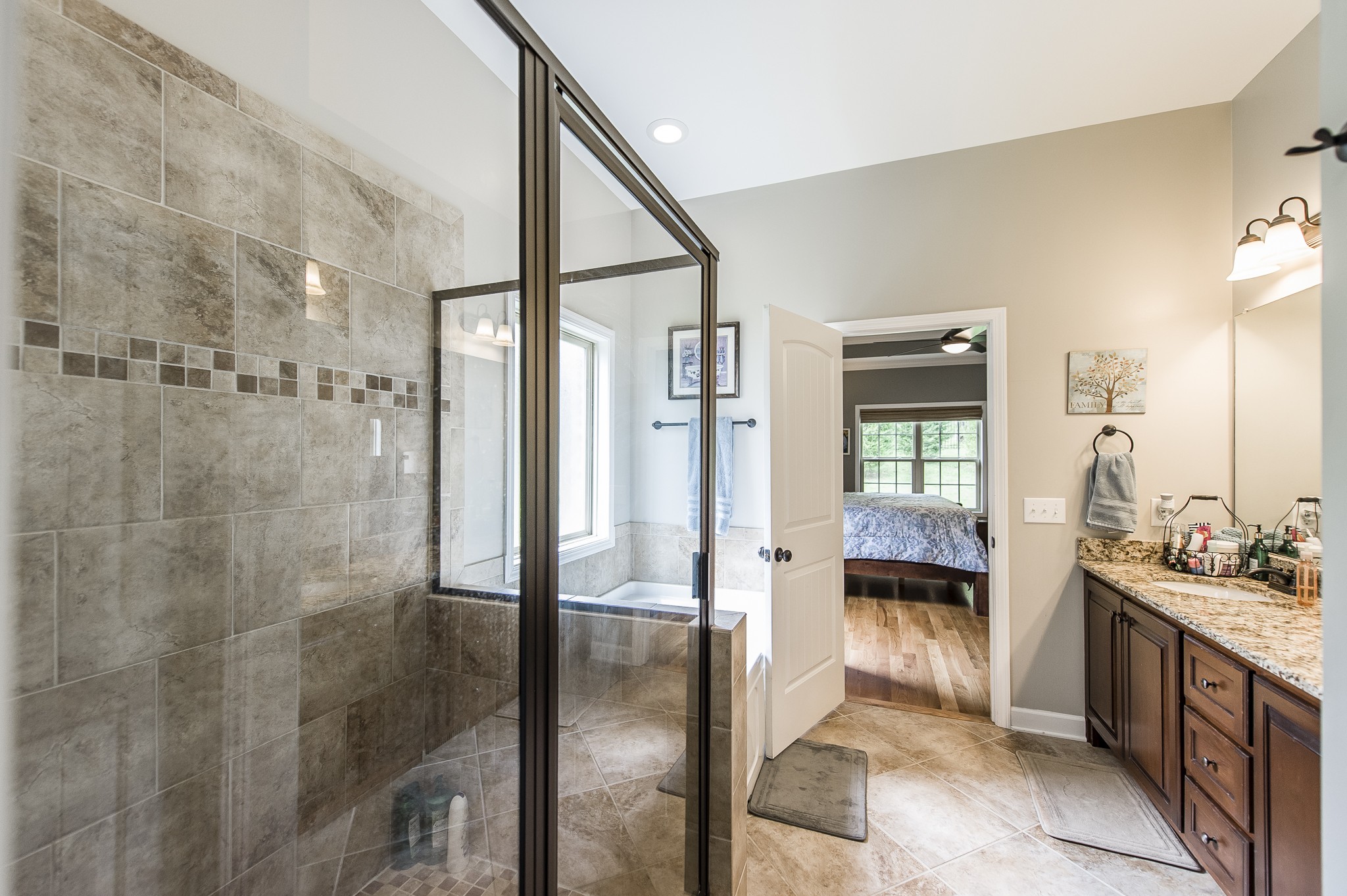 1145 Kimberly Drive Goodlettsville, TN 37072 - Photo 51 of 70 a bathroom with a double vanity sink a toilet and shower