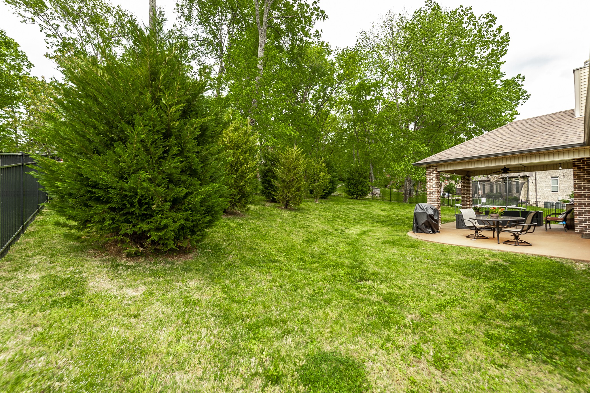 1145 Kimberly Drive Goodlettsville, TN 37072 - Photo 69 of 70 a view of backyard of a house with table and chairs