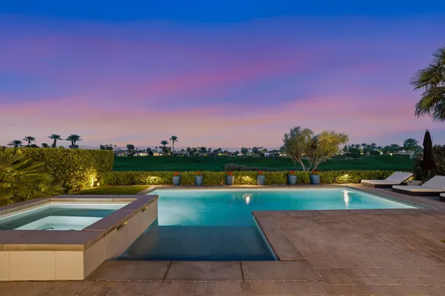 a view of swimming pool with a yard and a yard