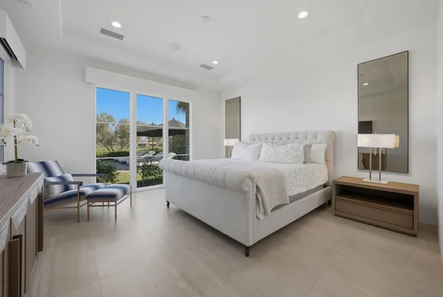 a bedroom with a large bed and tv