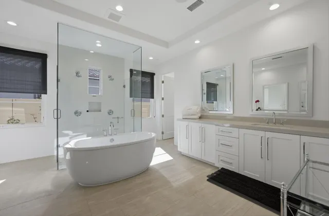 a bedroom with a bed a couch and a window