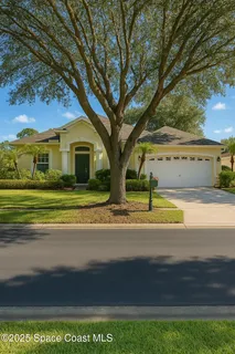 a view of a house with a big yard