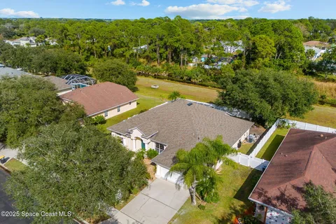 an aerial view of a house with a garden