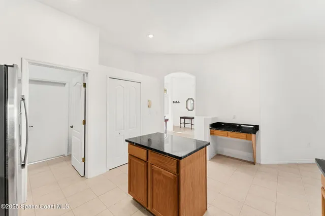 a bedroom with a bed and a television