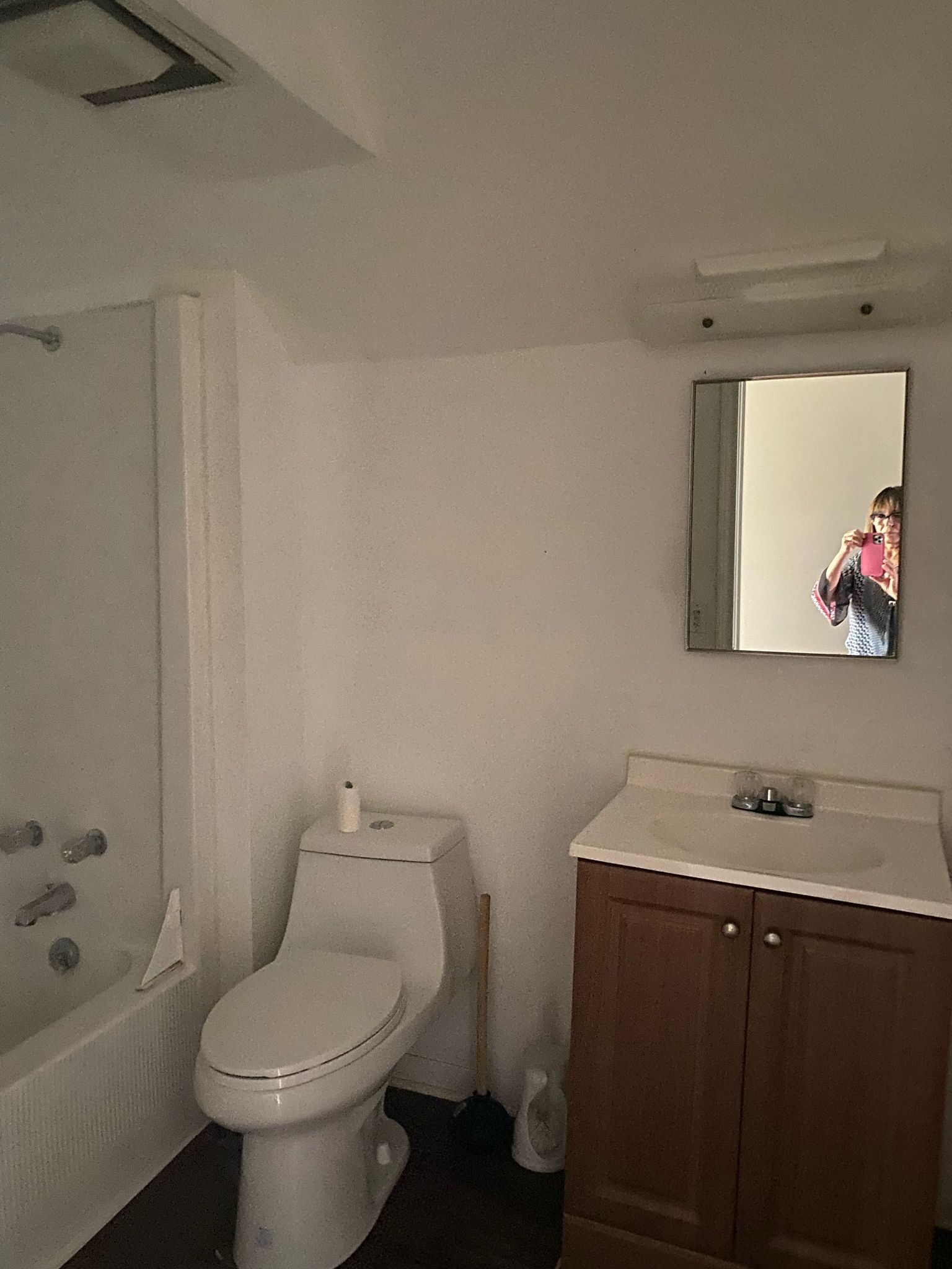 800 Travis Street, Unit ATTIC Columbus, TX 78934 - Photo 9 of 9 a bathroom with a toilet sink and mirror