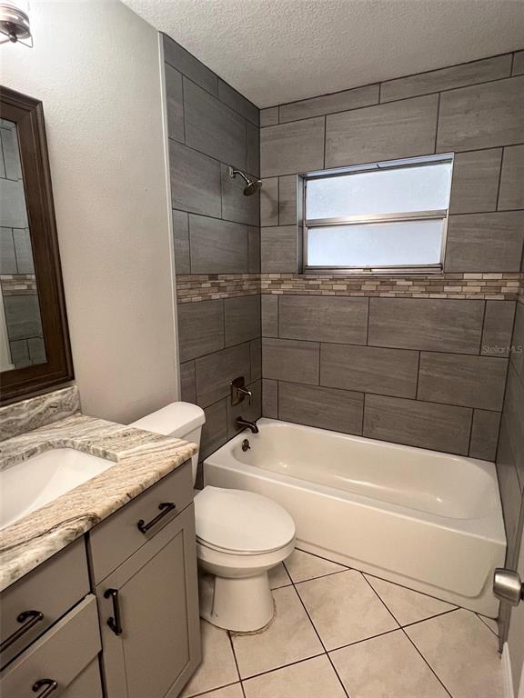 4317 Chipmunk Drive New Port Richey, FL 34653 - Photo 17 of 23 a bathroom with a sink a toilet and shower