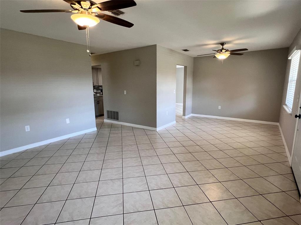 4317 Chipmunk Drive New Port Richey, FL 34653 - Photo 2 of 23 a view of an empty room and a ceiling fan